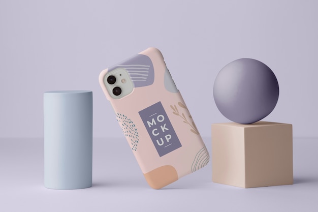 PSD smartphone avec étui de téléphone maquette et formes géométriques