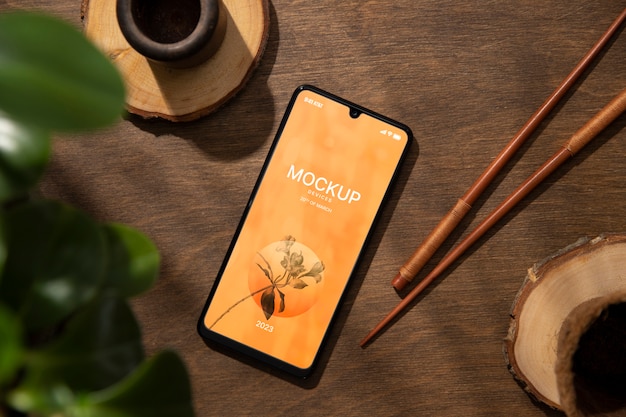 PSD smartphone-gerätemodell auf holzszene