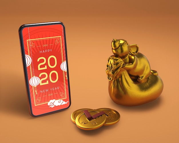 PSD smartphone junto a la estatua de oro para año nuevo