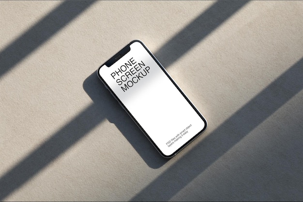 Smartphone mit Bildschirmmodell auf Betonboden
