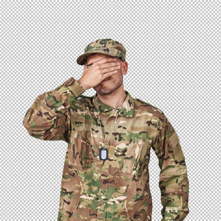 PSD soldier in camouflage uniform with his hand over his eyes showing frustration