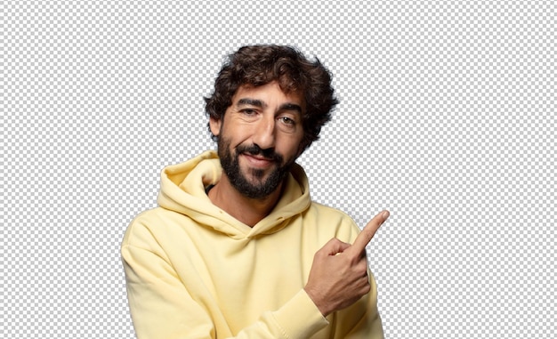 sonriendo alegremente sintiéndose feliz y señalando hacia el lado y hacia arriba mostrando el objeto en el espacio de copia