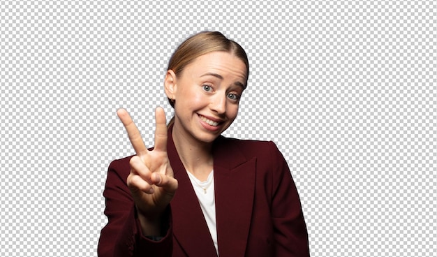 sonriendo y mirando feliz despreocupada y positiva gesticulando victoria o paz con una mano