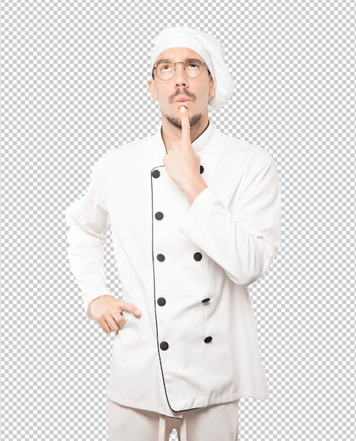 Sorprendido joven chef mirando gesto