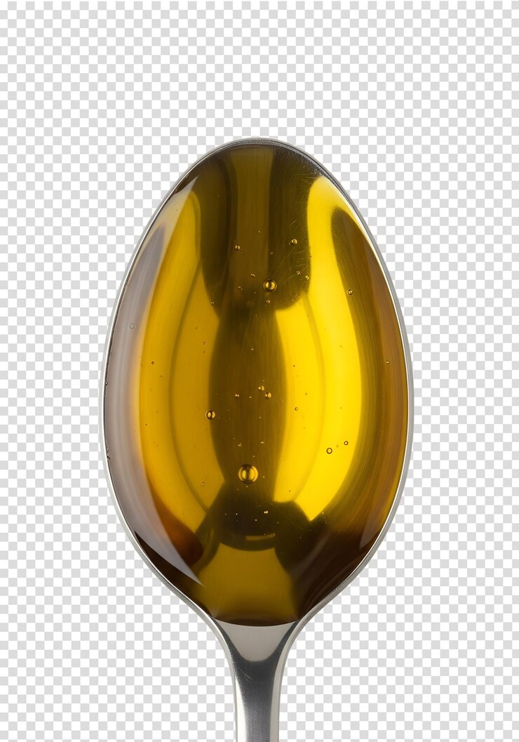 PSD spoonful of golden olive oil reflecting light isolated highquality closeup food ingredient