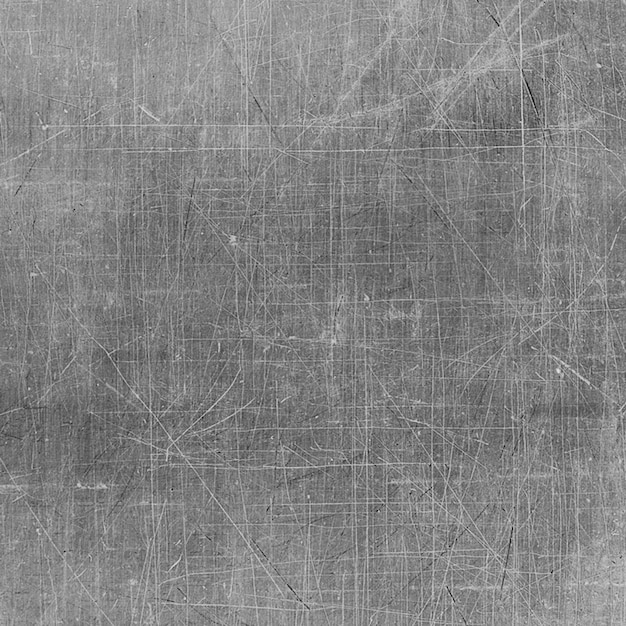Superficie metálica rayada y desgastada con líneas geométricas y textura