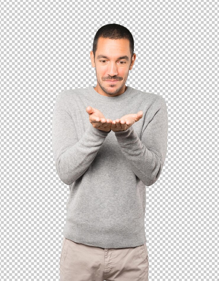 PSD surpris jeune homme tenant quelque chose avec sa main