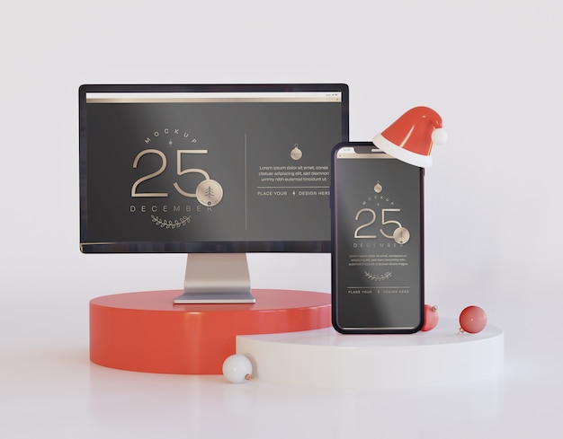 Tela de computador e maquete de smartphone com decoração de natal