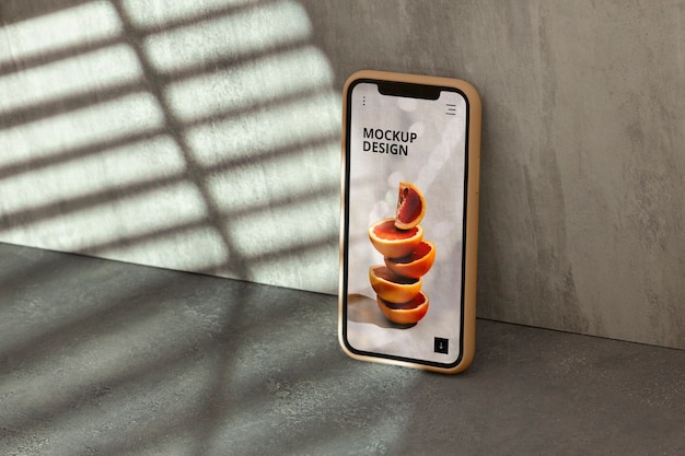 Telefono sul muro di cemento con ombra