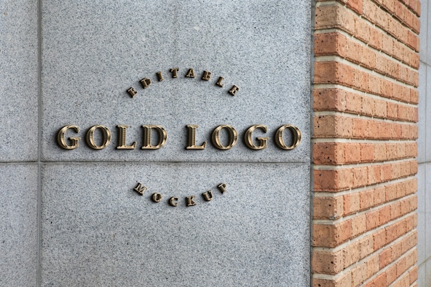 PSD texto dorado en diseño de logotipo de piedra.