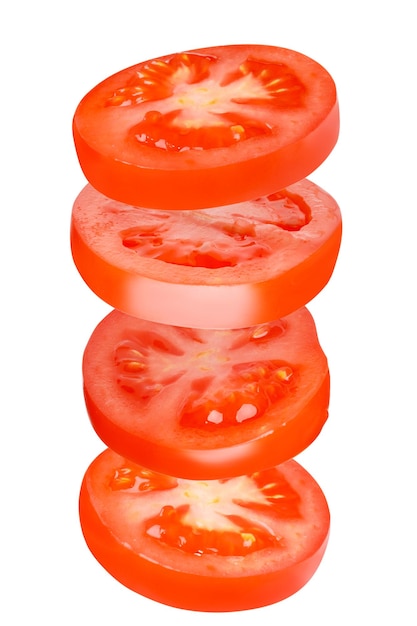 Tomates voladores cortados en círculos Tomates tomates cortados tomates frescos Aislado Vertical