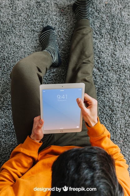 Top view of man using tablet