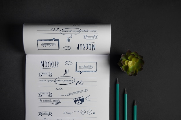 Top view sketchbook with drawings mockup