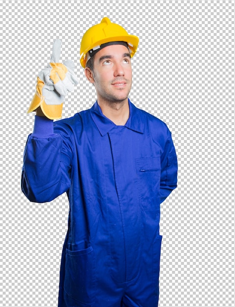 Trabajador confiado que señala para arriba en el fondo blanco