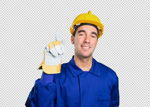 Trabajador feliz con gesto número uno sobre fondo blanco