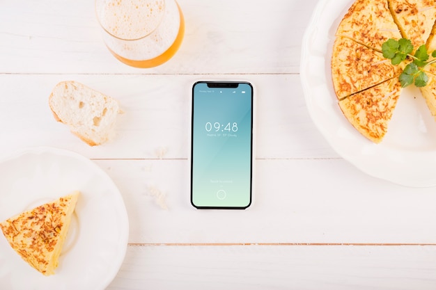 Traditional spanish food mockup with smartphone