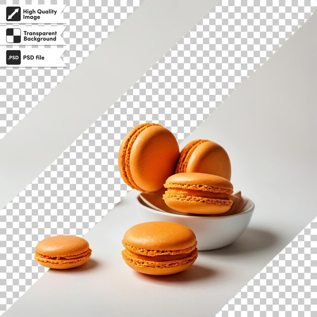 PSD trois macarons orange sont sur un bol avec un fond blanc