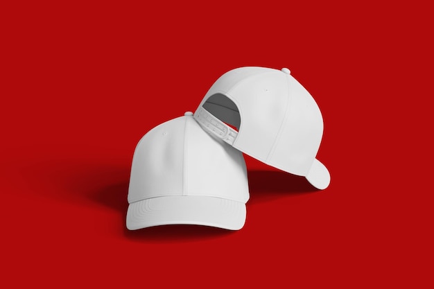 Two white baseball caps isolated on a red surface