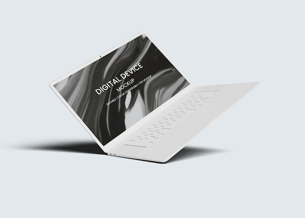 Um laptop com um dispositivo digital nele