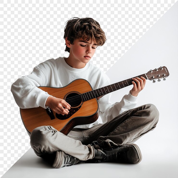 PSD um menino está sentado no chão e tocando guitarra