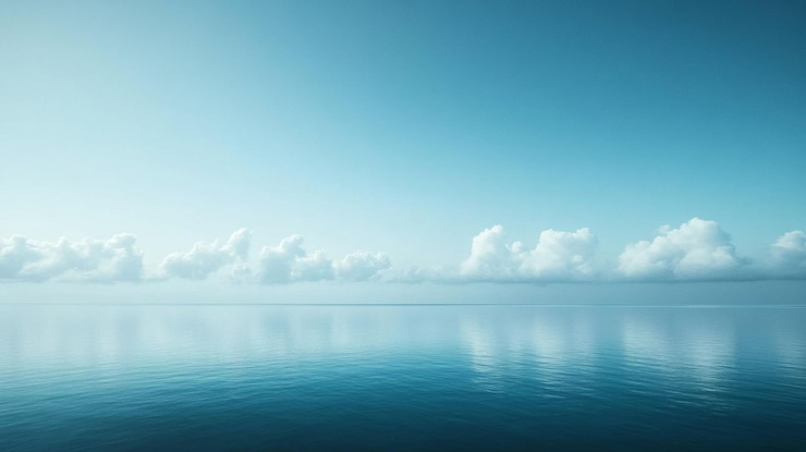 PSD uma cena tranquila do oceano com um céu azul claro e nuvens brancas fofinhas refletidas na superfície das águas