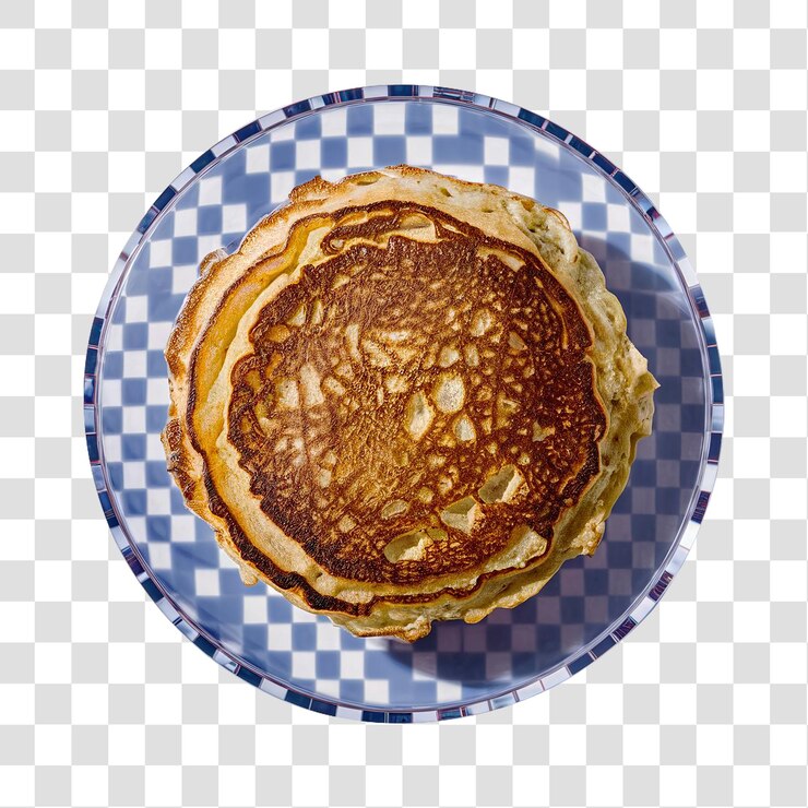 PSD un delizioso pancake d'oro su un piatto a scacchi pulito e isolato su uno sfondo trasparente