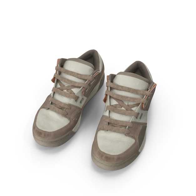 Un paio di scarpe da ginnastica marroni e beige usurate