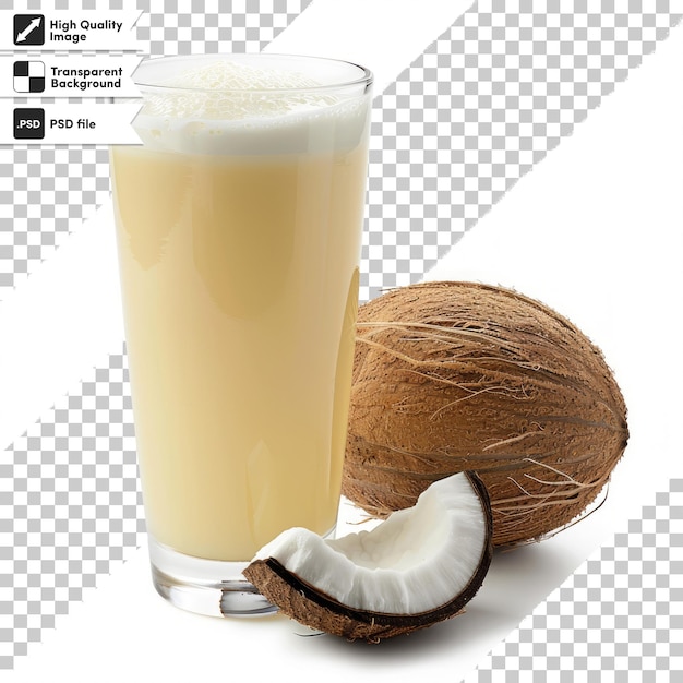 un vaso de jugo de coco junto a un coco