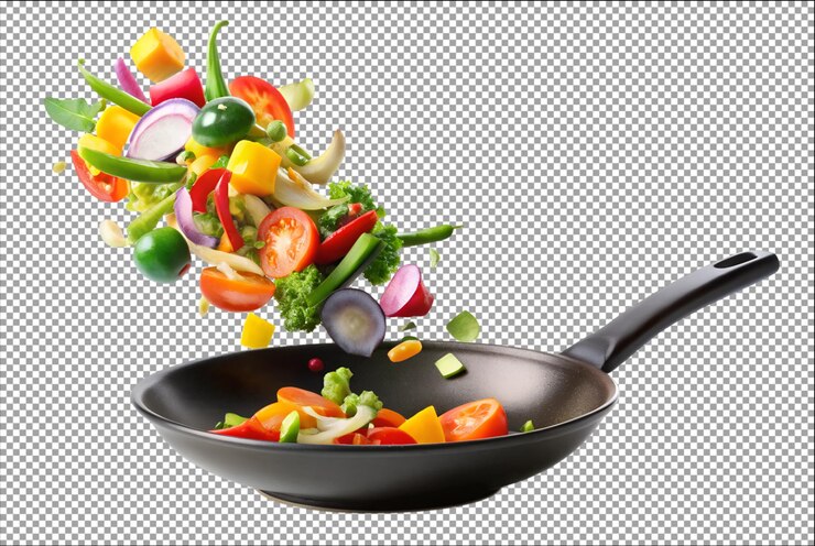 Las verduras caen en una sartén negra transformando los platos