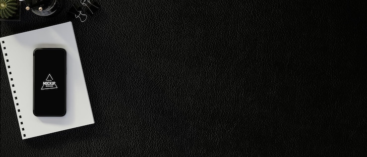 PSD vista dall'alto dell'area di lavoro moderna con smartphone mock up e spazio copia