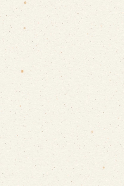 Vue rapprochée d'un papier beige crémeux texturé avec de petites taches et une apparence usée