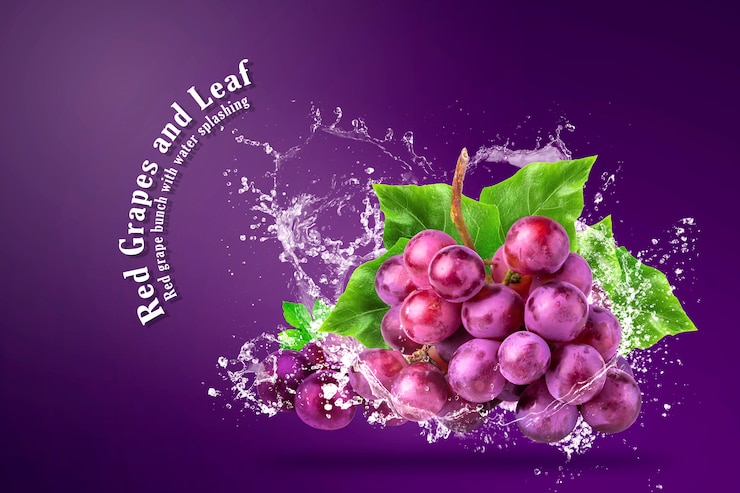 PSD water splashing on fresh red grapes over red background.