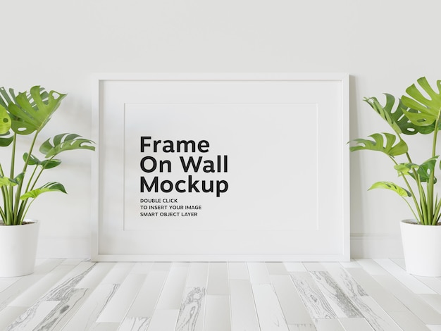 Weißer rahmen lehnt sich an die wand mockup