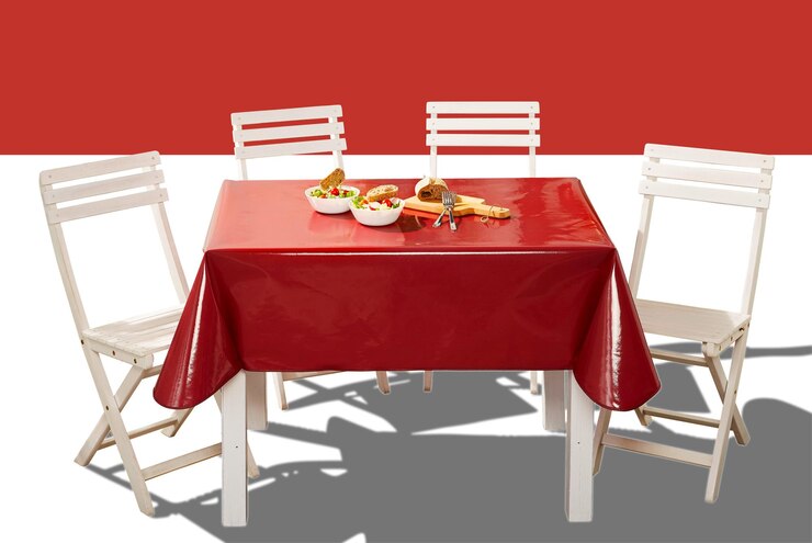 PSD white dining table set with folding chair and wine red table cloth foods plate on it
