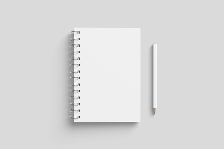 PSD white spiral notebook and pencil on a gray surface