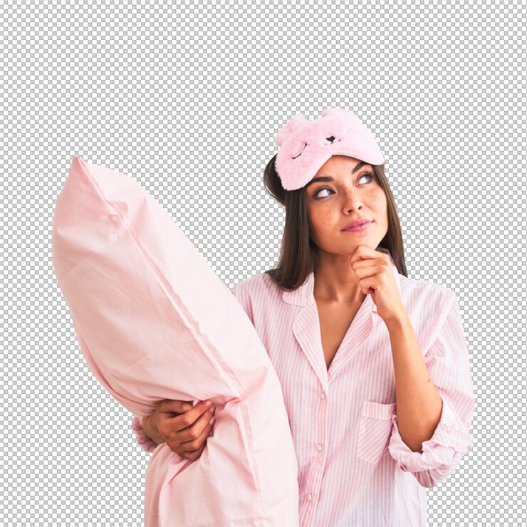 PSD woman in pajamas with a pillow and eye mask