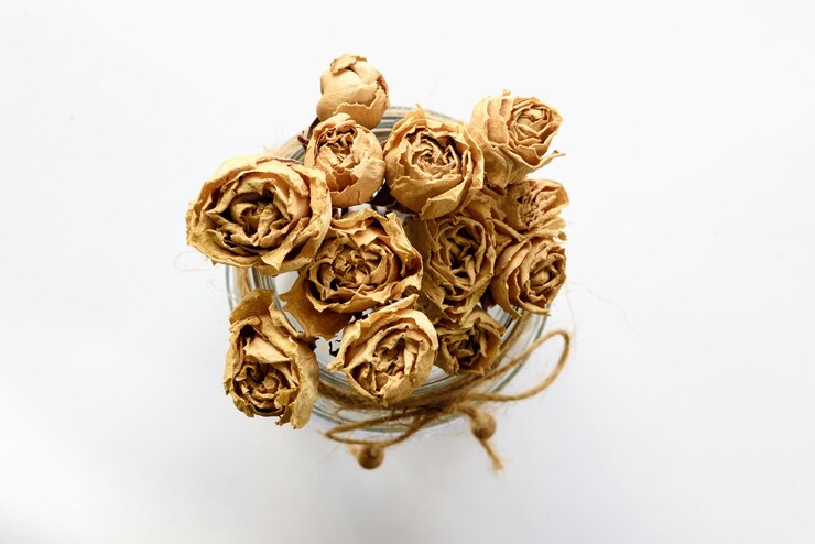 PSD yellow roses in a glass jar top view on a white background the concept of a gift and congratulations
