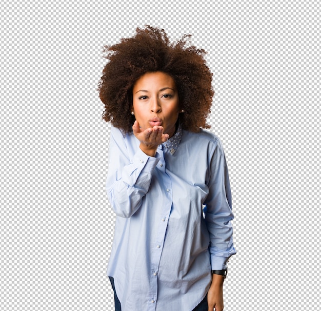 Young black woman sending a kiss