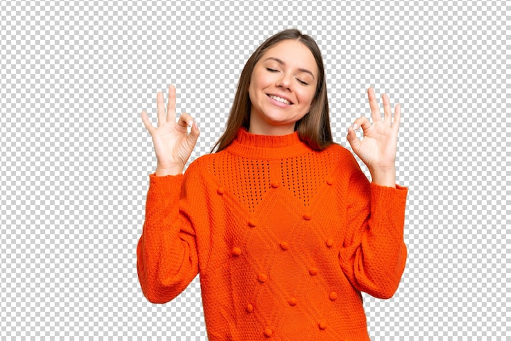 PSD young blonde woman over isolated chroma key background in zen pose