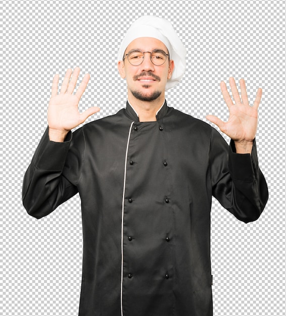Young chef making a number ten gesture