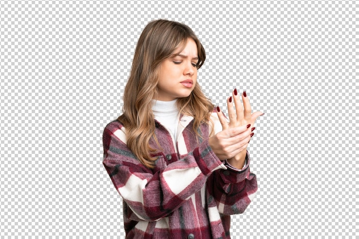 PSD young girl over isolated chroma key background suffering from pain in hands
