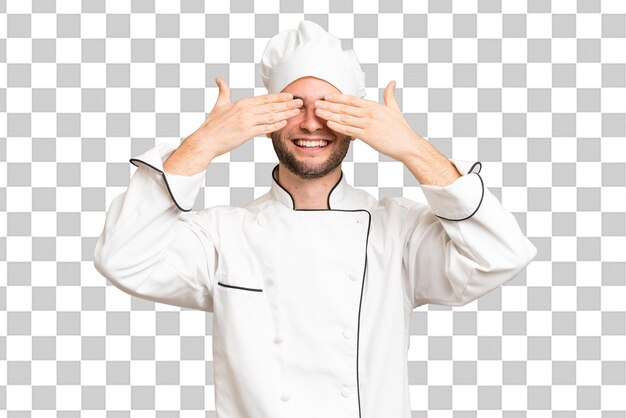 Young handsome chef man over isolated background covering eyes by hands