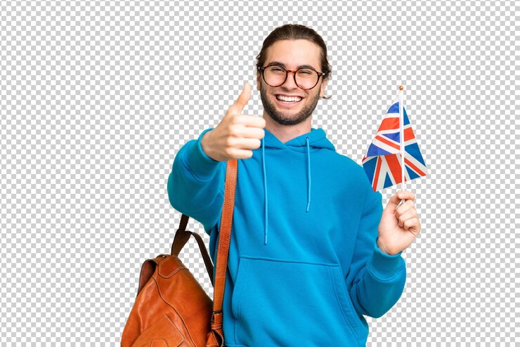 PSD young handsome man holding an united kingdom flag over isolated background with thumbs up because something good has happened