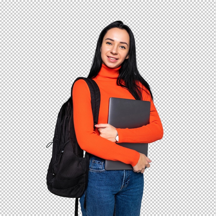 PSD young student girl isolated on gray wall smiling at camera pressing laptop to chest wearing backpack ready to go to studies start new project and suggest new ideas