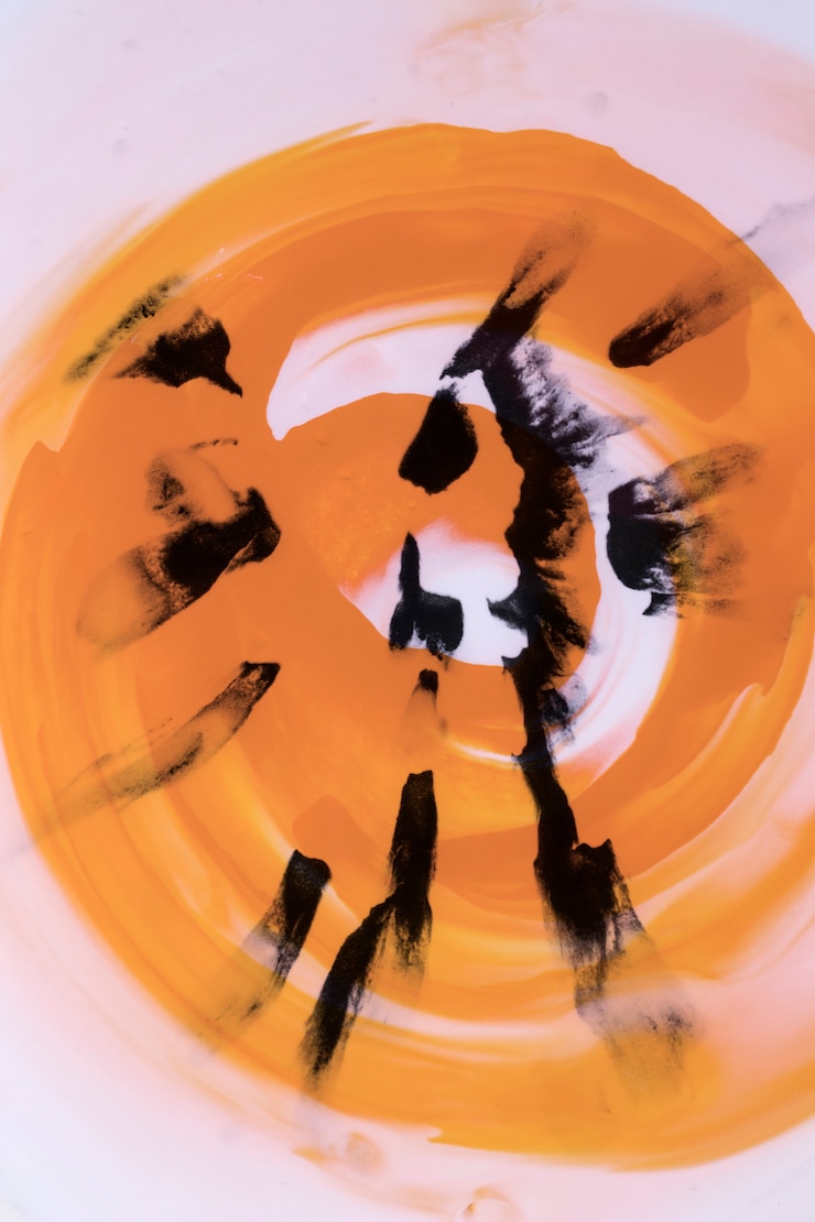 Ücretsiz Fotoğraf black brushstroke on swirl orange watercolor