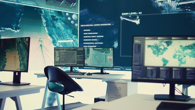 Empty military drone control center equipped with a big screen