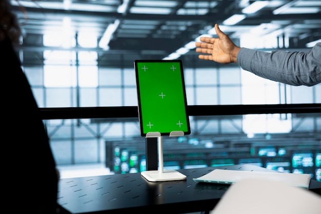 engineers using mockup tablet in data center managing server virtualization