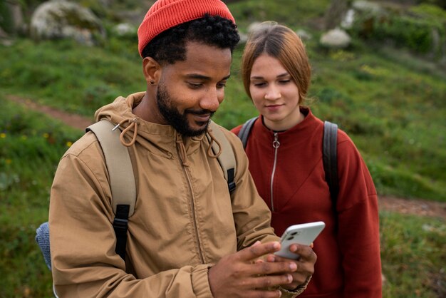 medium shot couple hiking together