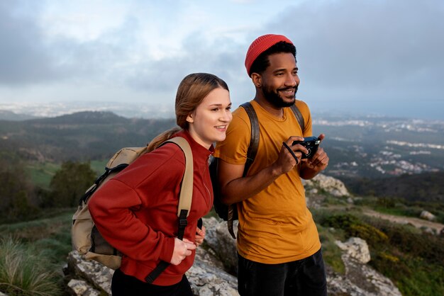 medium shot couple hiking together