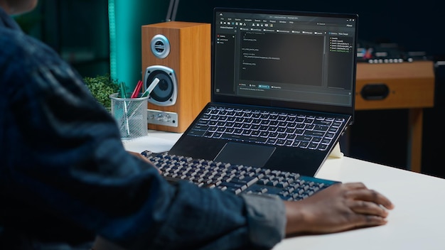 teleworker using laptop to do coding for software developing